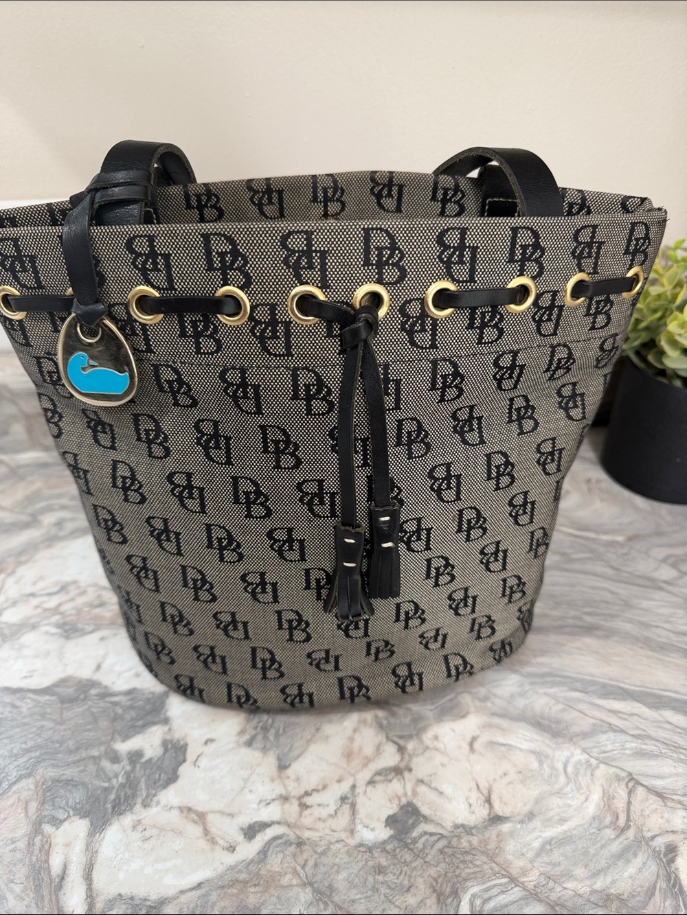 Dooney & Bourke Black & Beige Signature Drawstring Bucket Bag